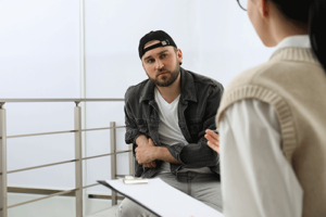 a person talks to a rehab staff member about rehab admissions