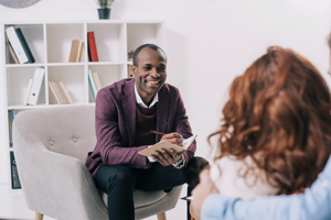 a therapist listens to a couple in a cognitive-behavioral therapy program