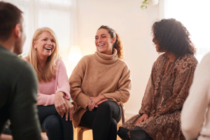 a group in an intensive outpatient program laughs