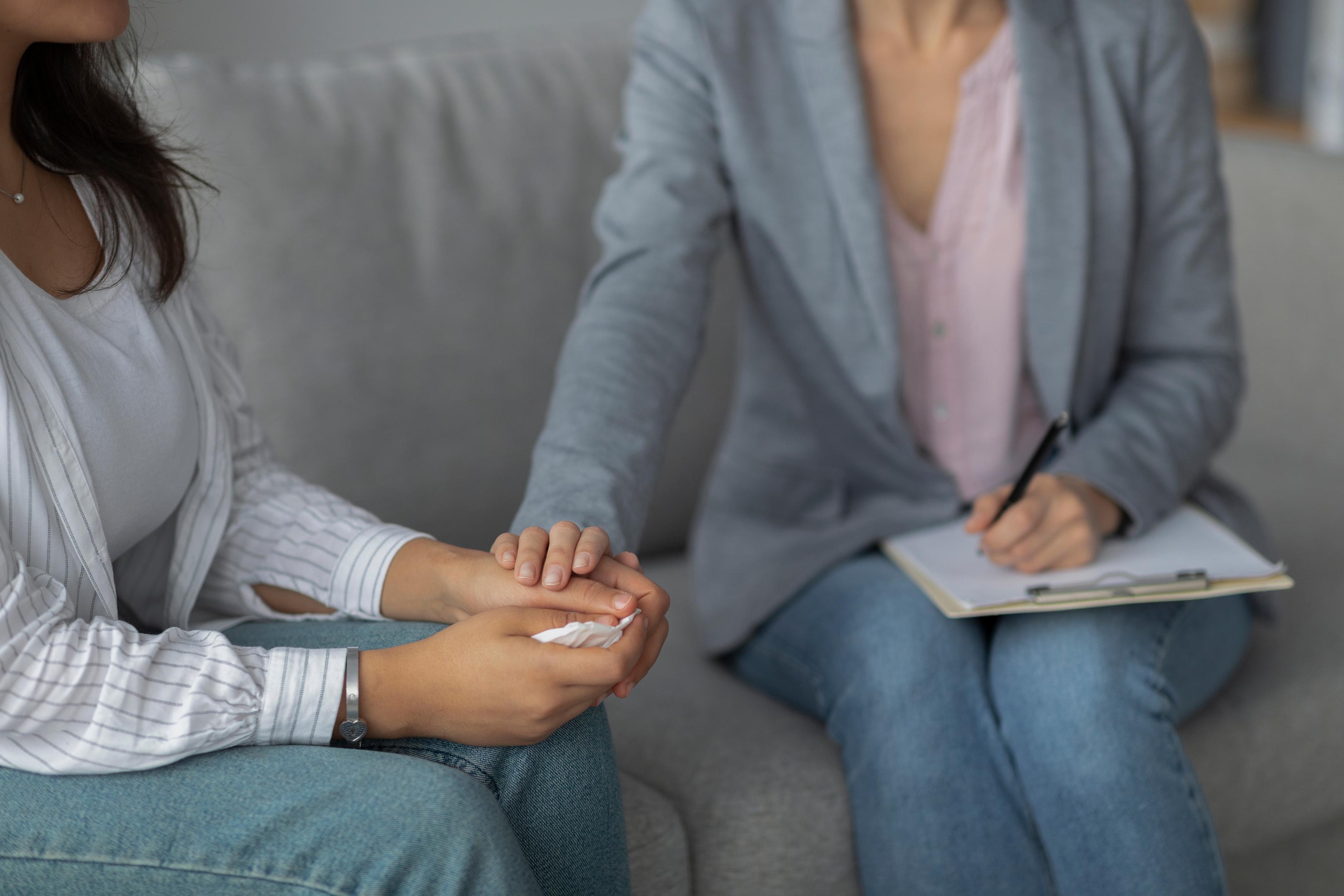 A client is comforted by her therapist during anxiety treatment